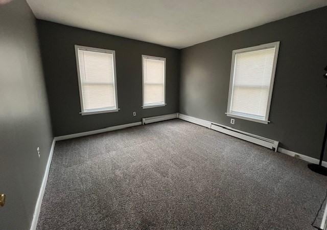 14 Felton St, Fitchburg, MA 01420 - carpeted empty room featuring baseboards