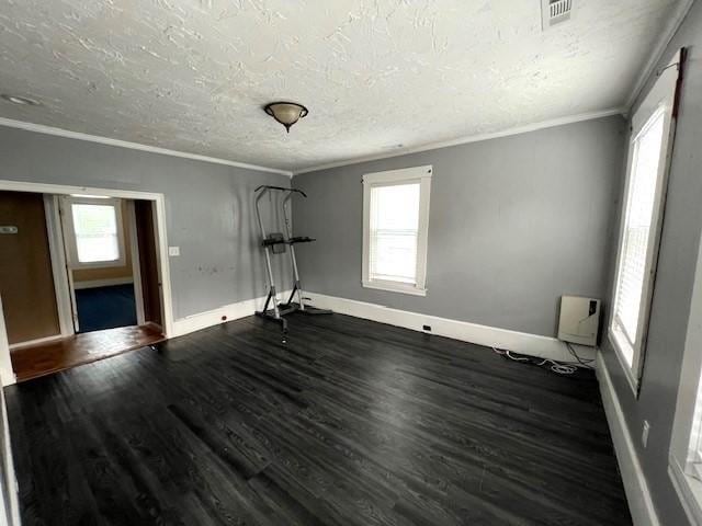 14 Felton St, Fitchburg, MA 01420 - spare room featuring ornamental molding, a textured ceiling, and dark wood finished floors