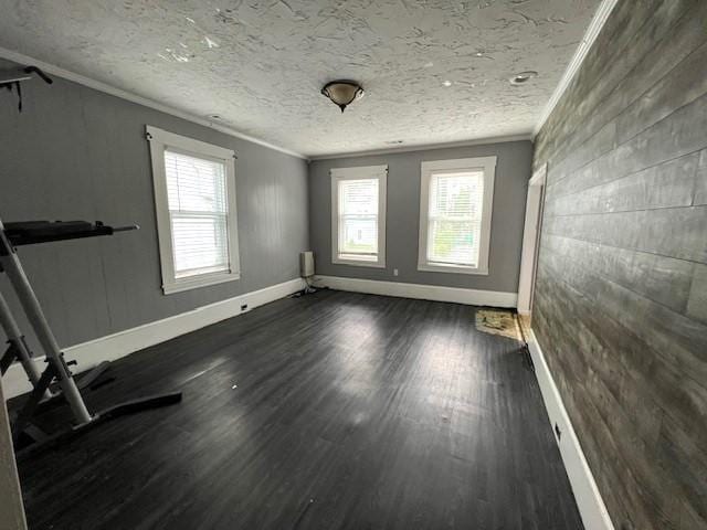 14 Felton St, Fitchburg, MA 01420 - spare room featuring crown molding, healthy amount of natural light, and dark wood-style flooring