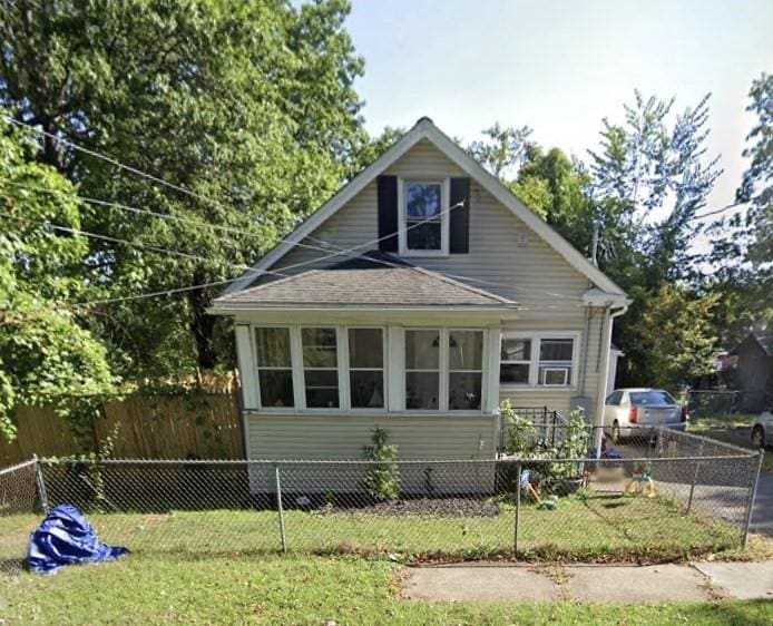 view of side of property featuring a yard