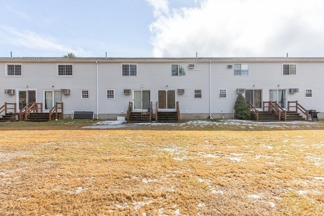 rear view of property featuring entry steps