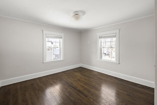 unfurnished room with ornamental molding, a healthy amount of sunlight, and dark hardwood / wood-style flooring