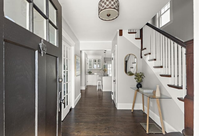 foyer entrance featuring dark hardwood / wood-style floors