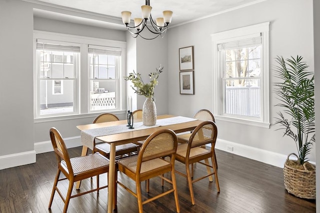 dining space with an inviting chandelier, crown molding, and dark wood-type flooring