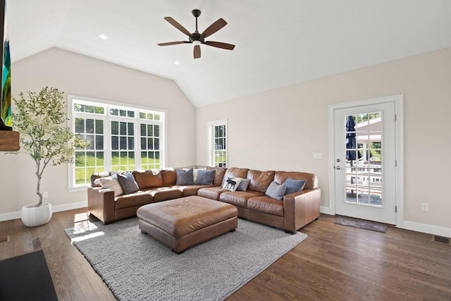 living room featuring lofted ceiling, ceiling fan, wood finished floors, baseboards, and recessed lighting