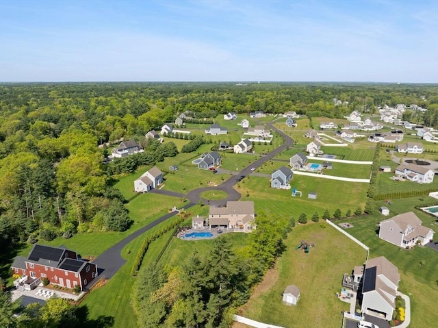 view of property location featuring a heavily wooded area