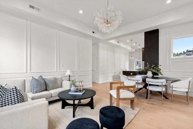 9 Russell Unit 1, Boston, MA 02129 - living area featuring a decorative wall, a chandelier, light wood finished floors, recessed lighting, and ornamental molding