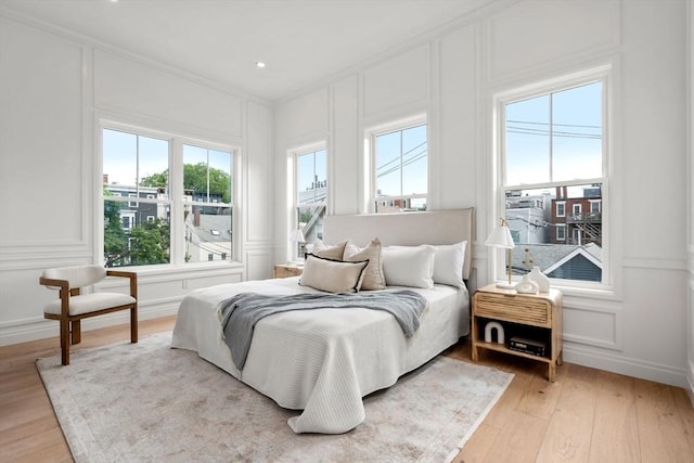 9 Russell Unit 1, Boston, MA 02129 - bedroom with a decorative wall, light wood finished floors, and ornamental molding