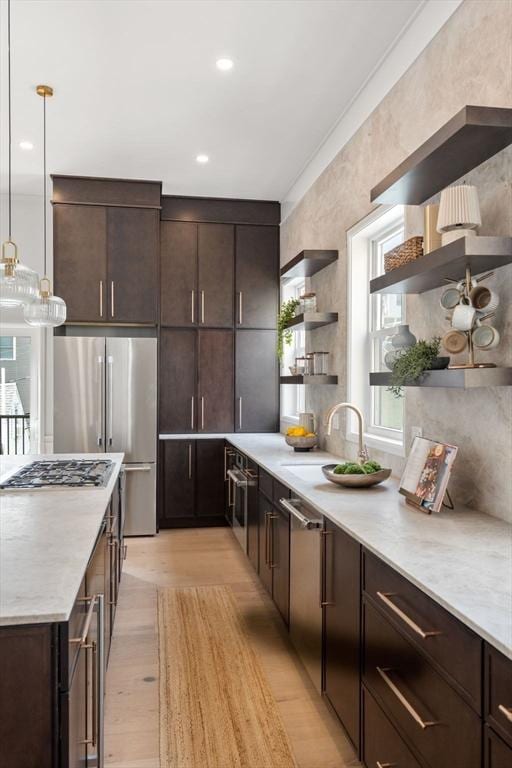 9 Russell Unit 1, Boston, MA 02129 - kitchen with open shelves, appliances with stainless steel finishes, dark brown cabinetry, and light wood-style floors
