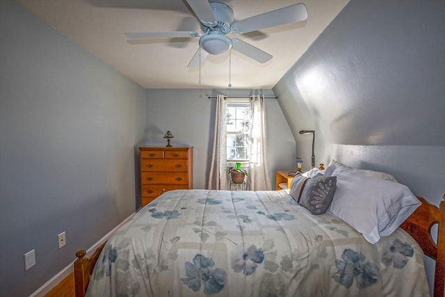 bedroom featuring lofted ceiling and ceiling fan