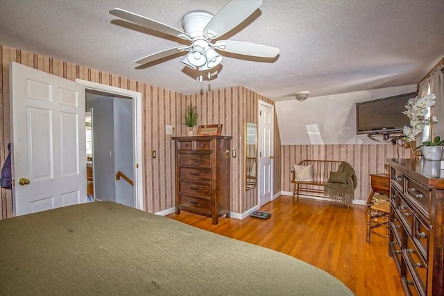 unfurnished bedroom with wood-type flooring and a textured ceiling