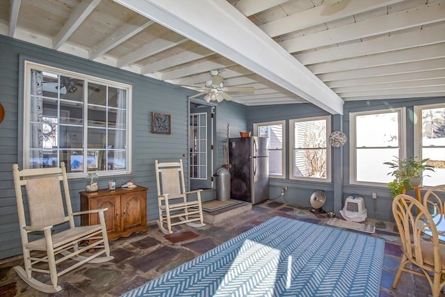 sunroom with beamed ceiling and ceiling fan