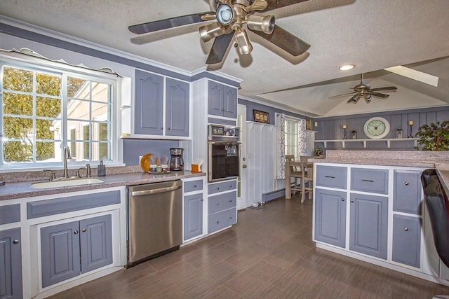 kitchen with vaulted ceiling, dishwasher, sink, oven, and stainless steel dishwasher