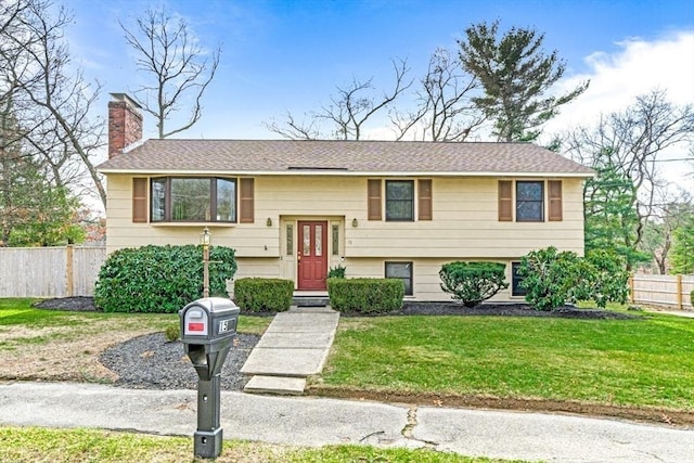 bi-level home featuring a front yard