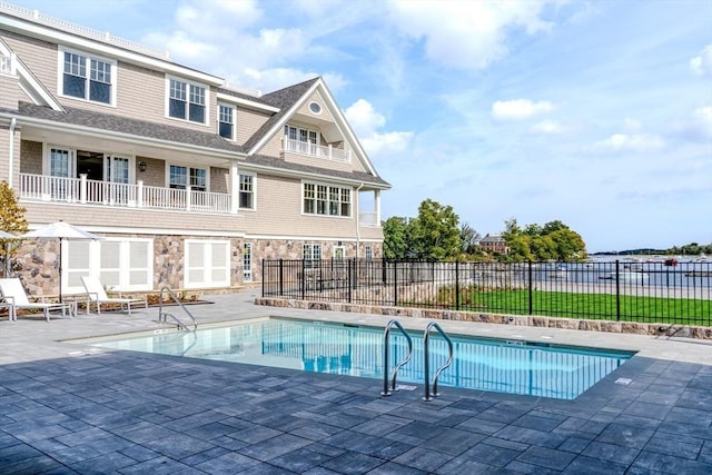 view of swimming pool featuring a patio area