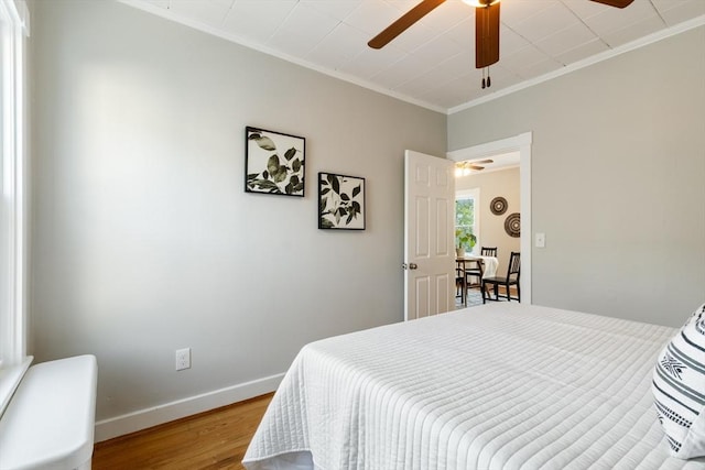 282 Palmer St, New Bedford, MA 02740 - bedroom with wood finished floors, ornamental molding, baseboards, and a ceiling fan