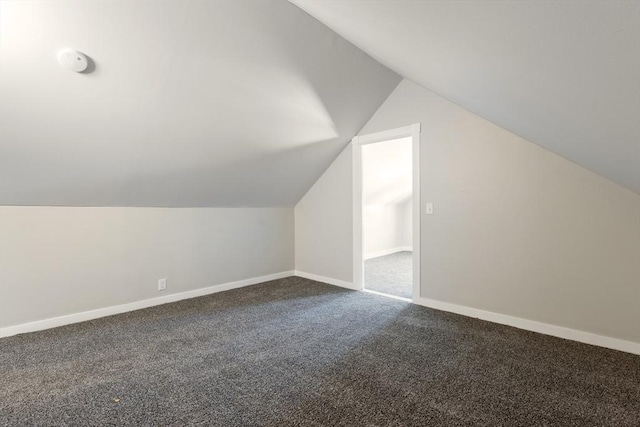 282 Palmer St, New Bedford, MA 02740 - bonus room featuring dark colored carpet, lofted ceiling, and baseboards