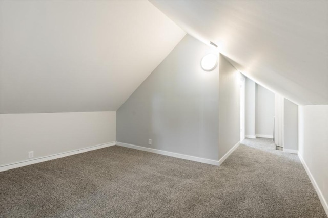 282 Palmer St, New Bedford, MA 02740 - bonus room with carpet floors, vaulted ceiling, and baseboards