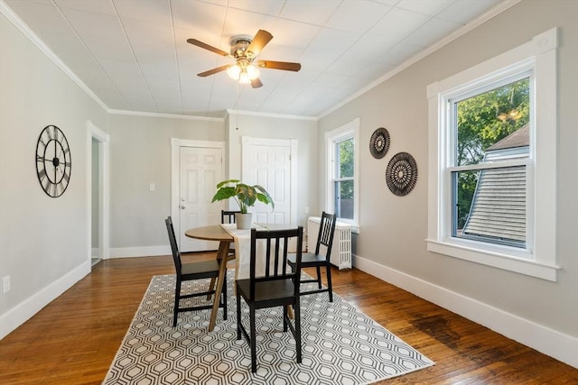 282 Palmer St, New Bedford, MA 02740 - dining room with ornamental molding, a ceiling fan, dark wood-style floors, and baseboards
