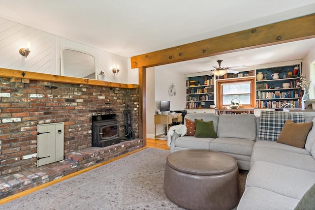 31 Blanding Rd, Rehoboth, MA 02769 - living room with a wood stove, ceiling fan, and beamed ceiling