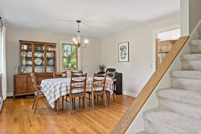 31 Blanding Rd, Rehoboth, MA 02769 - dining space featuring stairs, light wood-type flooring, a chandelier, and baseboards