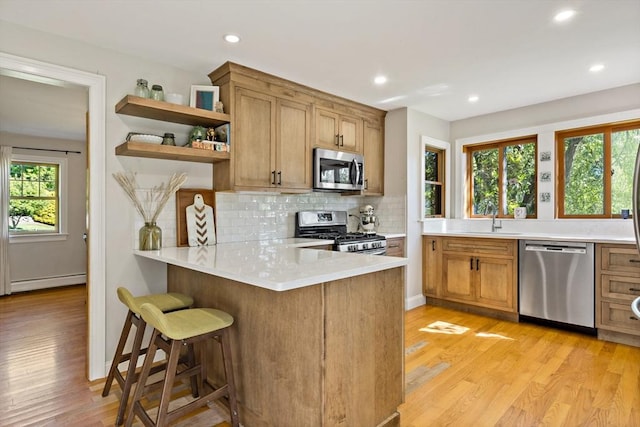 31 Blanding Rd, Rehoboth, MA 02769 - kitchen featuring stainless steel appliances, open shelves, a sink, light wood finished floors, and a baseboard radiator