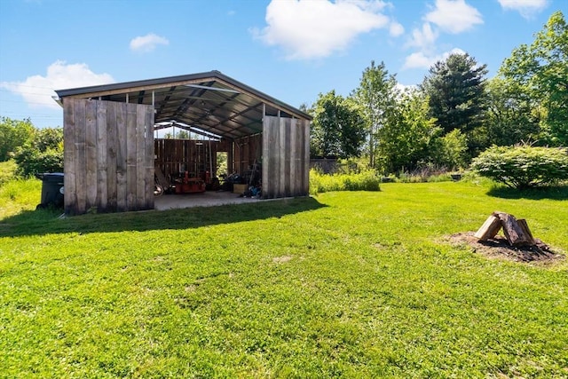 31 Blanding Rd, Rehoboth, MA 02769 - view of grassy yard featuring a detached carport, a pole building, and an outdoor structure