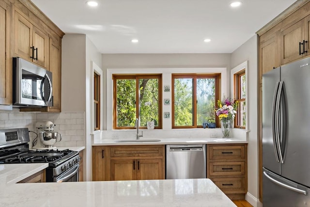 31 Blanding Rd, Rehoboth, MA 02769 - kitchen with stainless steel appliances, a sink, recessed lighting, tasteful backsplash, and brown cabinets