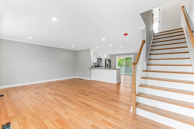 106 Pond St Unit U 30, Attleboro, MA 02703 - unfurnished living room featuring crown molding, light wood-type flooring, recessed lighting, stairway, and baseboards