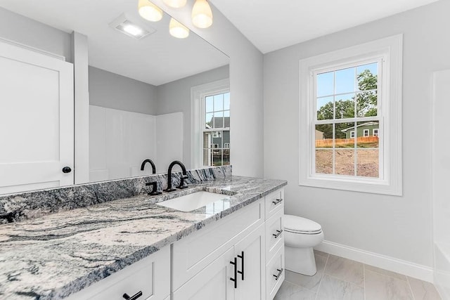 106 Pond St Unit U 30, Attleboro, MA 02703 - bathroom with baseboards, vanity, toilet, and marble look tile flooring