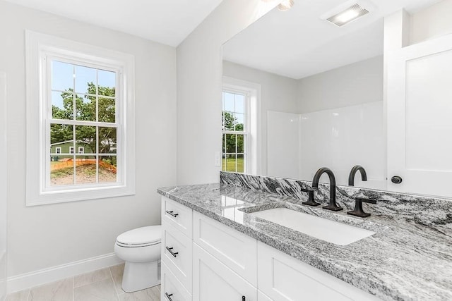 106 Pond St Unit U 30, Attleboro, MA 02703 - bathroom with baseboards, toilet, vanity, and marble look tile flooring