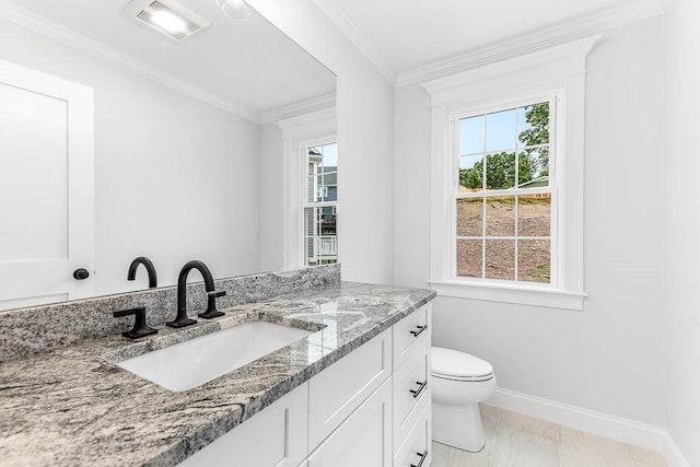 106 Pond St Unit U 30, Attleboro, MA 02703 - bathroom with marble look tiles, toilet, baseboards, vanity, and ornamental molding