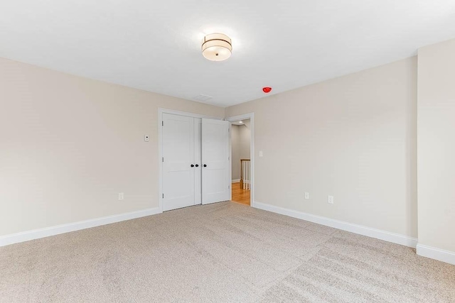 106 Pond St Unit U 30, Attleboro, MA 02703 - unfurnished bedroom featuring light carpet, baseboards, and a closet