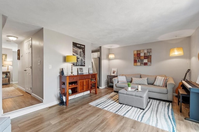 193 Patrick Rd Unit 193, Tewksbury, MA 01876 - living room with light wood-style flooring and baseboards