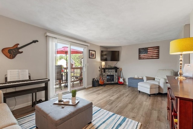 193 Patrick Rd Unit 193, Tewksbury, MA 01876 - living area with a fireplace and wood finished floors