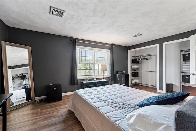 193 Patrick Rd Unit 193, Tewksbury, MA 01876 - bedroom with dark wood-type flooring and a textured ceiling