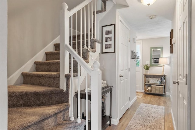 193 Patrick Rd Unit 193, Tewksbury, MA 01876 - staircase with wood finished floors and baseboards