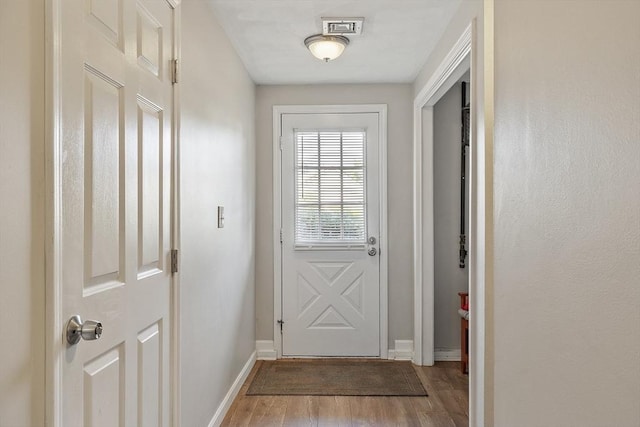 193 Patrick Rd Unit 193, Tewksbury, MA 01876 - doorway to outside featuring light wood-style floors and baseboards