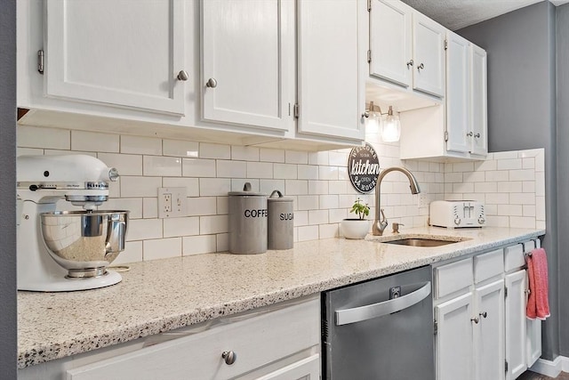 193 Patrick Rd Unit 193, Tewksbury, MA 01876 - kitchen featuring stainless steel dishwasher, white cabinets, tasteful backsplash, and light stone countertops