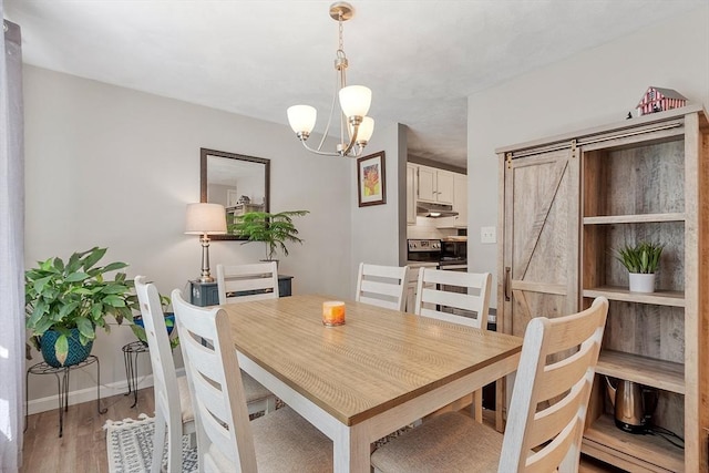 193 Patrick Rd Unit 193, Tewksbury, MA 01876 - dining space featuring a chandelier and light wood-style flooring