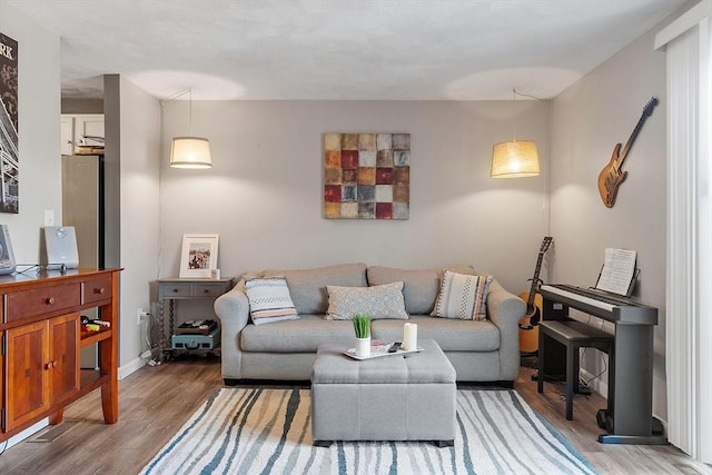193 Patrick Rd Unit 193, Tewksbury, MA 01876 - living area with light wood-style flooring and baseboards