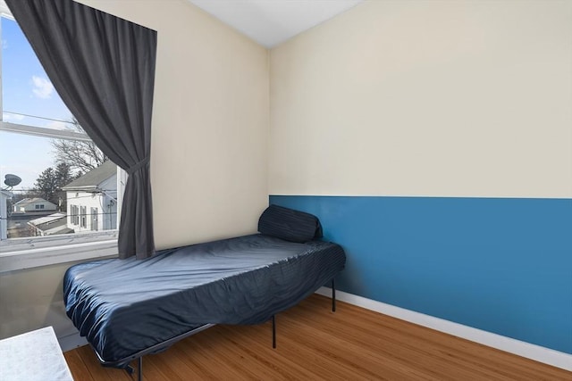 bedroom with hardwood / wood-style floors