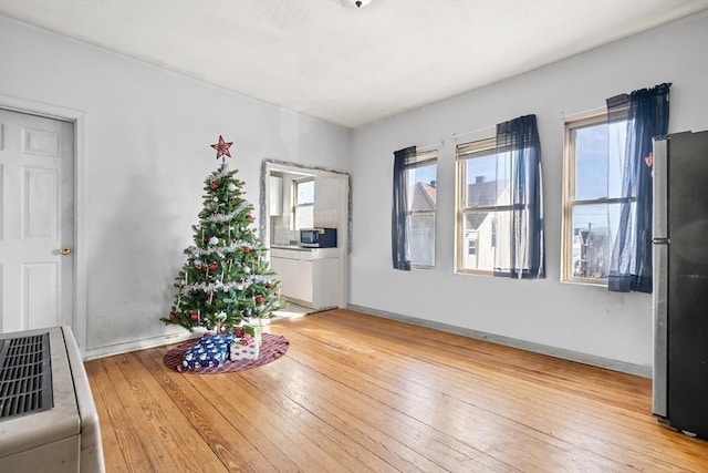 unfurnished dining area featuring light hardwood / wood-style floors and a wealth of natural light