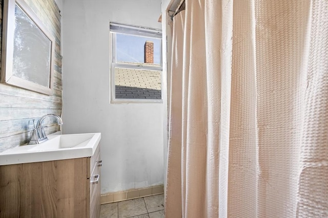 bathroom with tile patterned floors and vanity