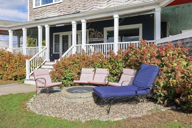 view of patio / terrace featuring covered porch and an outdoor fire pit