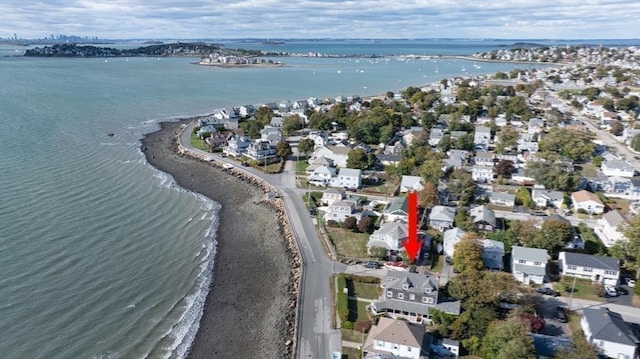 aerial view featuring a view of the beach and a water view