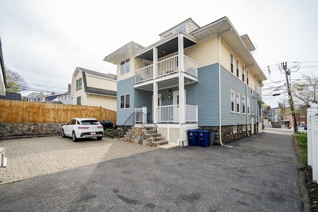 12 Highland Ave Unit 1, Arlington, MA 02476 - view of front facade with fence and a balcony