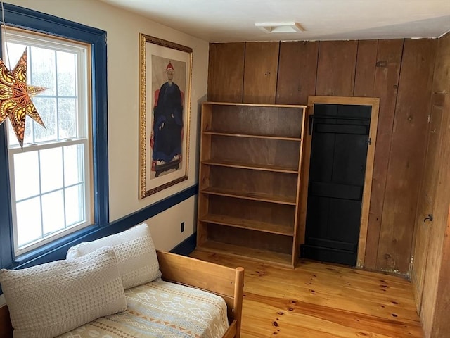 living area featuring light wood finished floors and visible vents