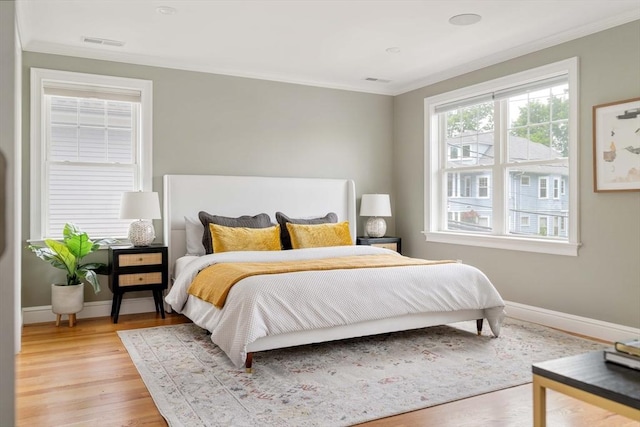 31 Neponset Ave, Boston, MA 02131 - bedroom featuring crown molding and light wood-style flooring