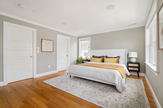 31 Neponset Ave, Boston, MA 02131 - bedroom with multiple windows, light wood-style flooring, and ornamental molding